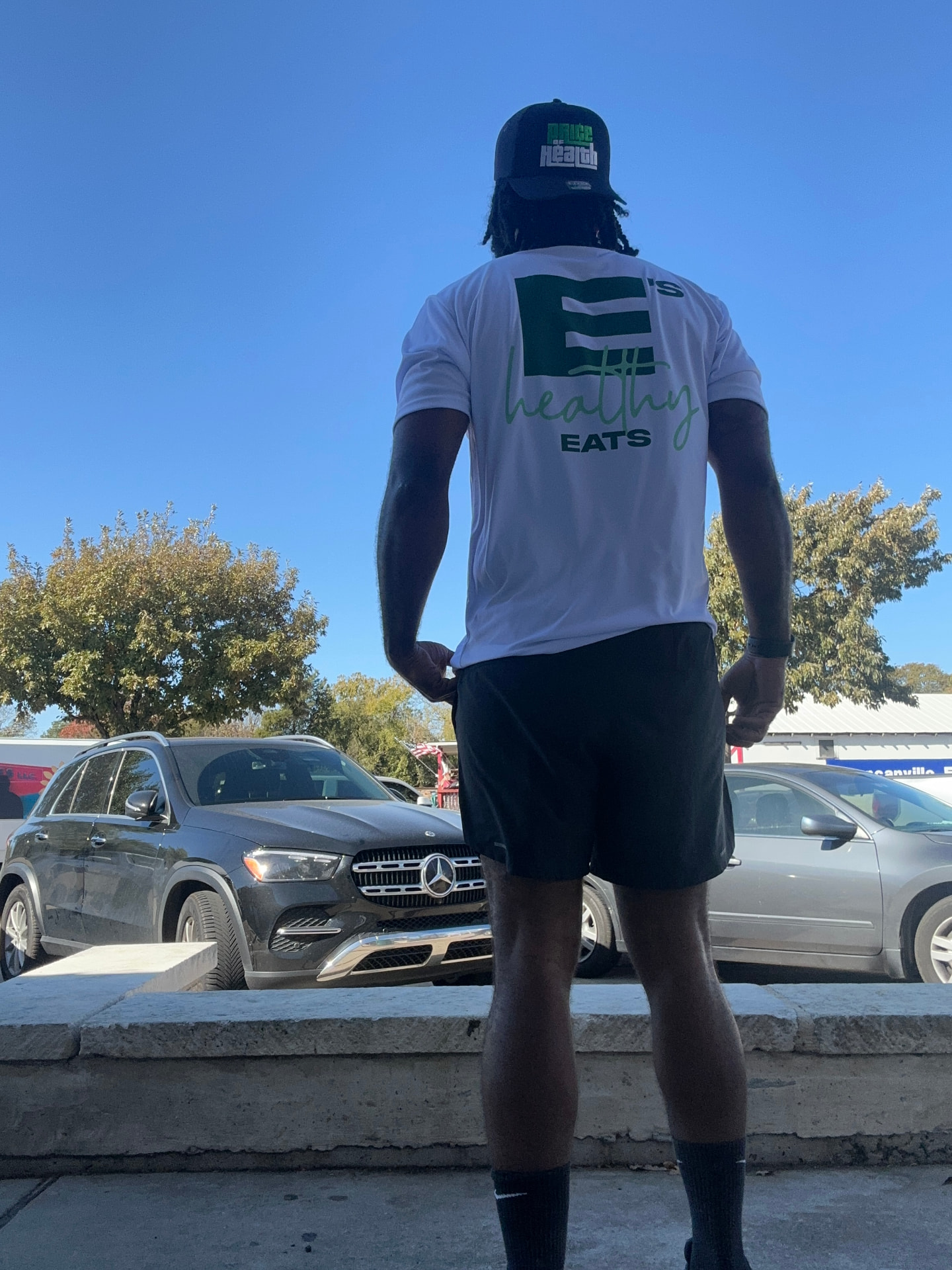 Earl today, wearing a white E's Healthy Eats shirt and Price of Health hat